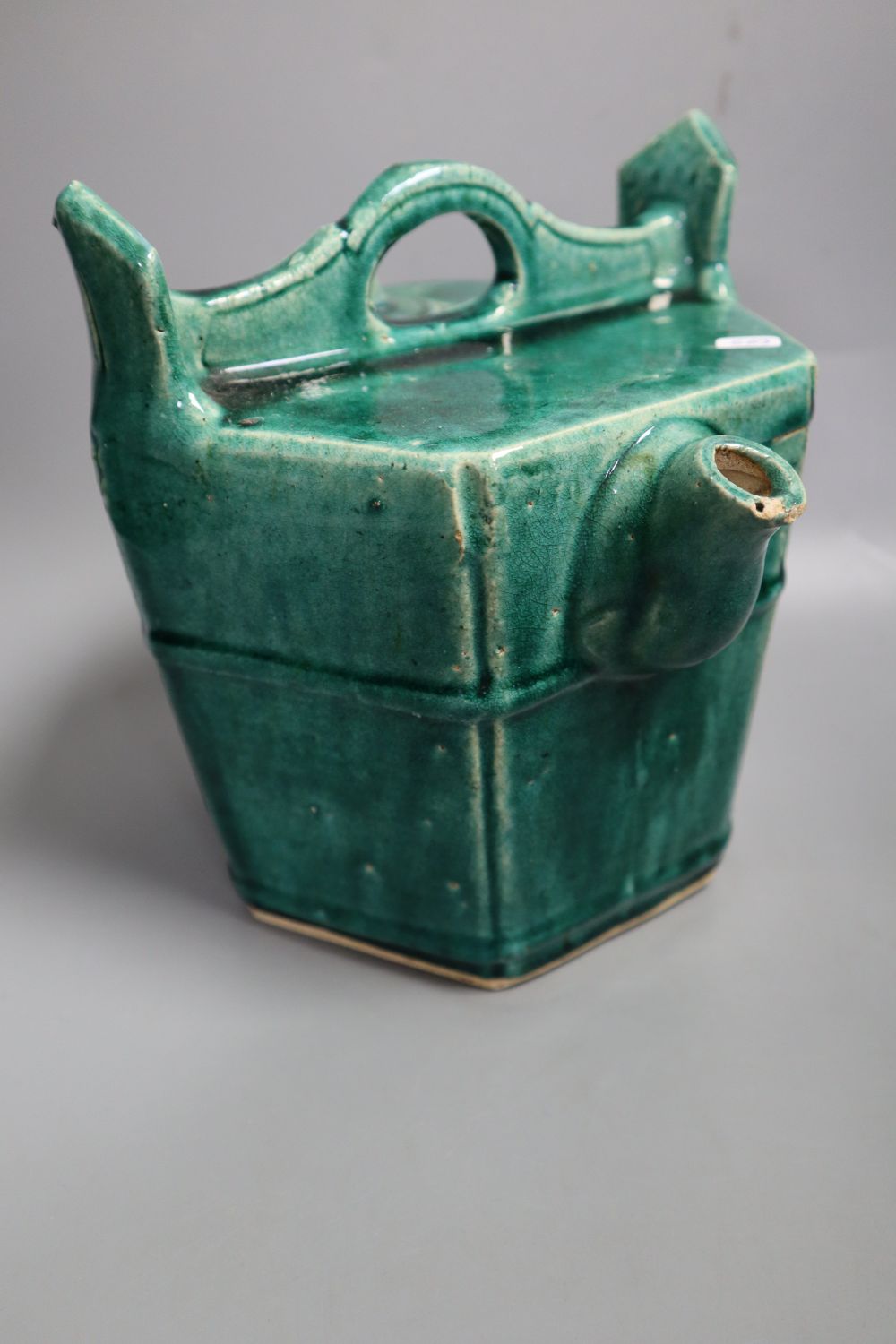 A Chinese green glazed teapot, 20.5cm high, a Cizhou type vase, a turquoise glazed vase and a Japanese tea bowl